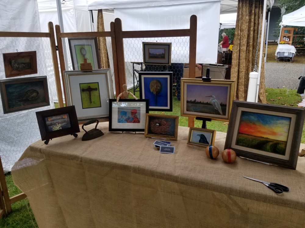 A booth displaying the works of Harper Ewing