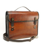 A warm brown leather messenger bag made by Brian Rosenbarker.