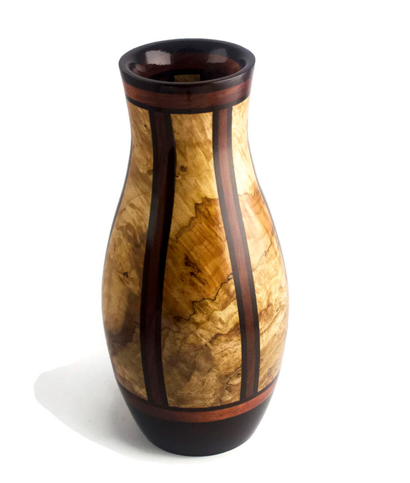A tall tan wooden vase by Scott Foster with thin brown stripes from top to base.