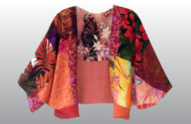 A photo of a pink kimono with various floral patterns, by Marguerite Swope.