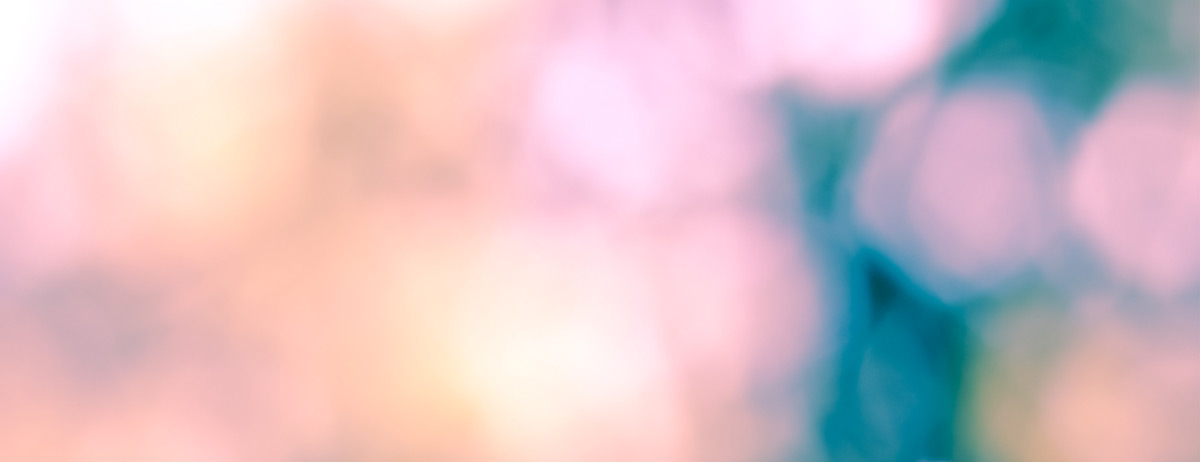 Image of a light pink and blue bokeh background.